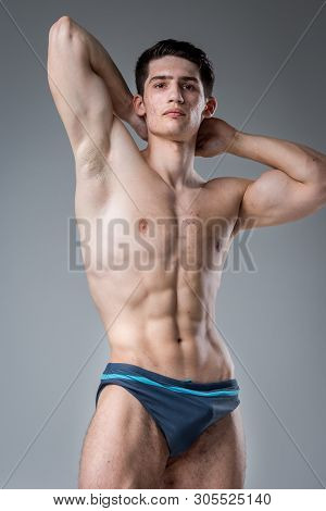 Studio Portrait Young Caucasian Man On Gray Background Posing. Theme Of Puberty, Problem Skin, Teen 