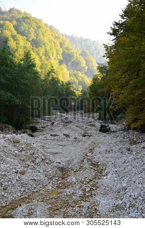 View Of A Stone Mountain River With Stones In The Cherek Gorge In The Mountains Of The North Caucasu