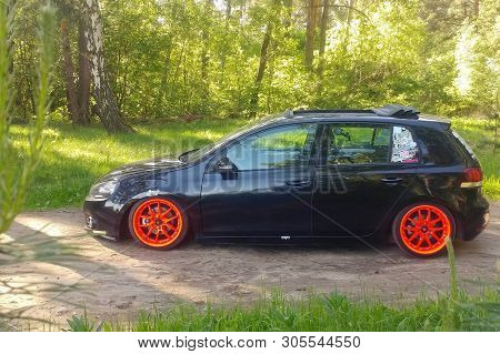 Russia, Moscow - June 01, 2019: Black Volkswagen Golf Mk6 Tuned With Ragtop And Orange Wheels. Stanc
