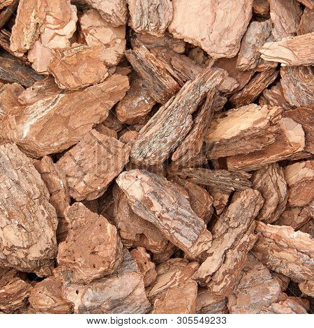 Background Of Pieces Of Pine Bark, Used For Design And Drainage In Parks And Gardens