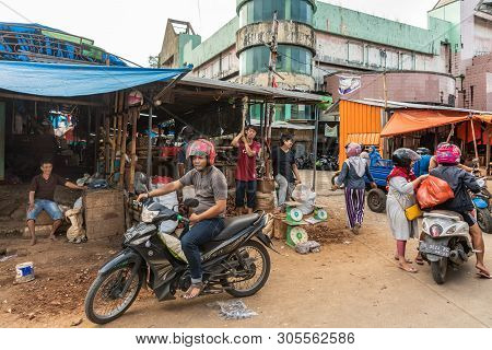 Makassar, Sulawesi, Indonesia - February 28, 2019: Terong Street Market. Street Scene With Motorbike