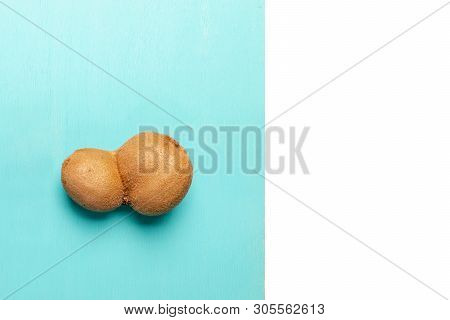 One Ugly Conjoined Kiwi On Turquoise - White  Background.