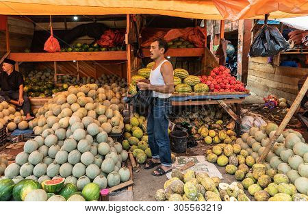 Makassar, Sulawesi, Indonesia - February 28, 2019: Terong Street Market. Fruit Booth Offers Heaps Of
