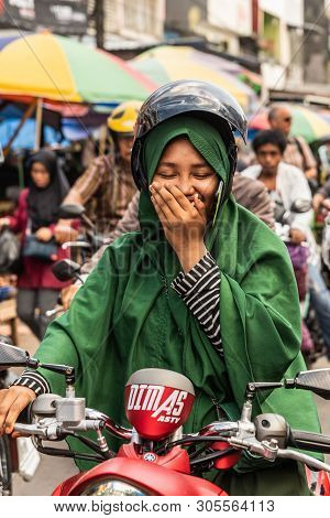 Makassar, Sulawesi, Indonesia - February 28, 2019: Terong Street Market. Closeup Portrait Of Woman W