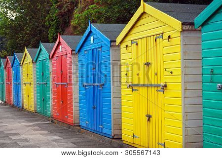 Beach Huts Or Colorful Bathing Boxes On The Beach.