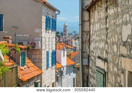 Old Town Of Split In Dalmatia, Croatia. Panoramic View Of City Center From Narrow Old Street With St