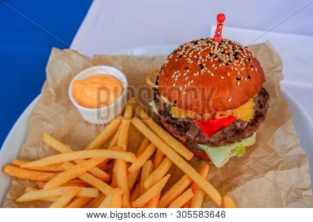 Craft Beef Burger And French Fries On Table Isolated.tasty Burger And Fries.fast Food Concept.cheese