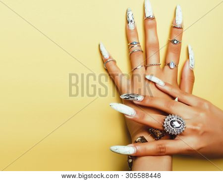 Woman Hands Holding Colorful Paper Copyspace Wearing A Lot Of Jewelry And Long Nails