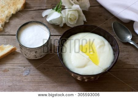 Homemade Breakfast Of Semolina Porridge, Coffee With Milk And Toast On A Wooden Background. Rustic S