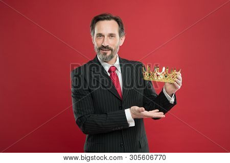 Man Bearded Guy In Suit Hold Golden Crown Symbol Of Monarchy. Become King Ceremony. Award And Achiev