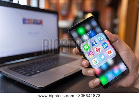 Chiang Mai, Thailand - May.01,2019: Man Holding Xiaomi Mi Mix 3 With Icons Of Social Media On The Sc