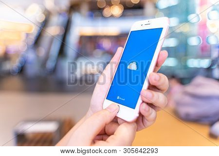Chiang Mai, Thailand - May.10,2019: Woman Holding Apple Iphone 6s Rose Gold With Onedrive On Screen.