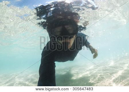 Underwater Young Man Snorkeling Having Fun In The Sea