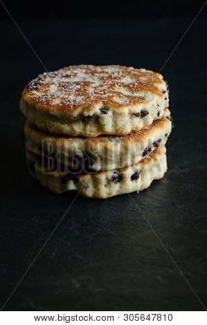 Welsh Cakes A Traditional Griddle Cake Made With Flour And Dried Fruit On A Slate Background