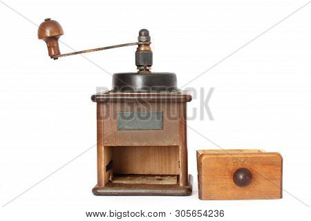Manual Coffee Grinder On A White Background. Antiquary