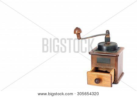 Manual Coffee Grinder On A White Background. Antiquary
