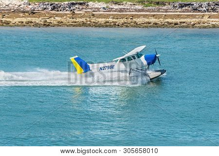 Miami, Fl, United States - April 20, 2019: The Seaplane Cessna 172n Skyhawk Takes Off In The Miami M