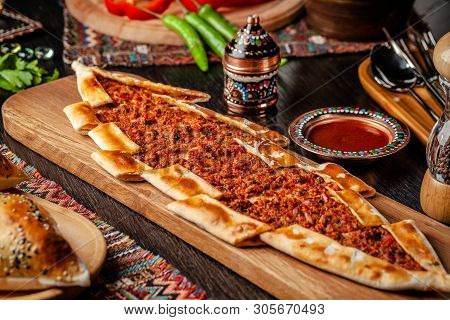Traditional Turkish Cuisine. Turkish Pizza Pita With Meat. Turk Pidesi Or  Sucuk Pide. Beautiful Ser