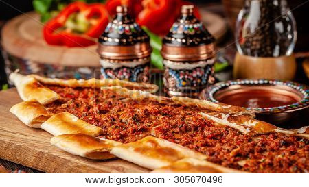 Traditional Turkish Cuisine. Turkish Pizza Pita With Meat. Turk Pidesi Or  Sucuk Pide. Beautiful Ser