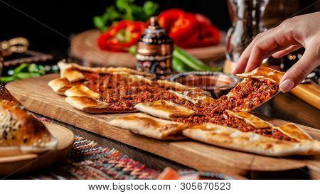 Traditional Turkish Cuisine. Turkish Pizza Pita With Meat. Turk Pidesi Or  Sucuk Pide. Beautiful Ser