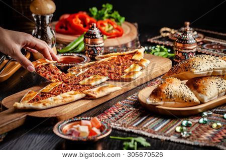 Traditional Turkish Cuisine. Turkish Pizza Pita With Meat. Turk Pidesi Or  Sucuk Pide. Beautiful Ser