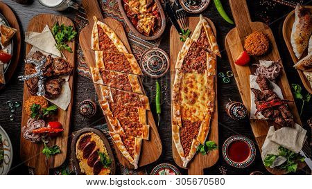 Traditional Turkish Cuisine. Pizza, Pita, Pidesi, Sucuk, Hummus, Kebab, Bulgar. Many Dishes On The T