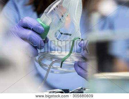Nurse Prepares Oxygen Mask In Hospital, Conceptual Image