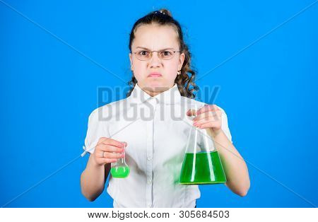 Science Research In Lab. Small School Girl. Education And Knowledge. Small Girl With Testing Flask. 