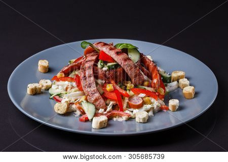 Salad With Grilled Sausage Paprica Cucumber And Croutons