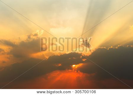 Natural Sunset Sunrise Over Field Or Meadow. Bright Dramatic Sky And Dark Ground. Countryside Landsc