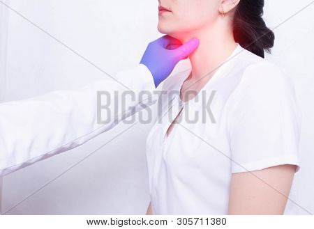 A Specialist Doctor Diagnoses And Examines A Girls Sore Throat, The Presence Of Inflammation And Swe