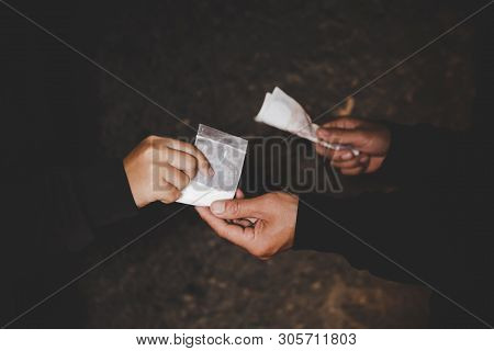 Close Up Of Addict With Money Buying Dose, Drug Trafficking, Crime, Addiction And Sale Concept