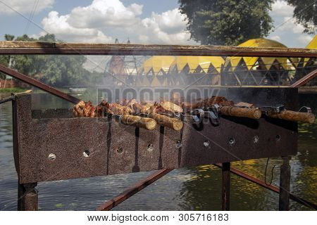 Shashlik Of  Mutton, Beef Or Chicken Meat On The Barbeque Outdoor At The River Side Or Sea Coast