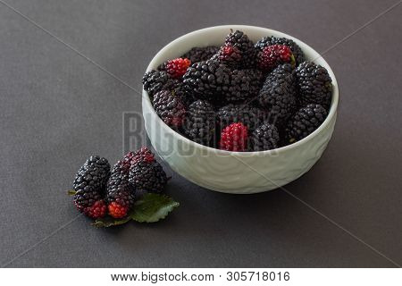 Fresh Organic Vietnamese Black Mulberry On Grey Background In Green Bowl