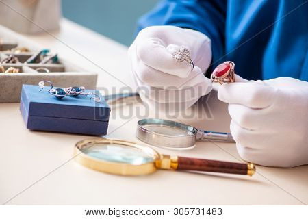 Young jeweler working in his workshop