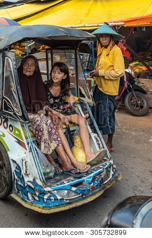 Makassar, Sulawesi, Indonesia - February 28, 2019: Terong Street Market. Closeup Of Grandma And Gran