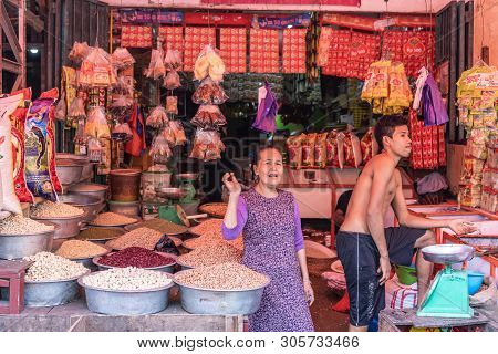 Makassar, Sulawesi, Indonesia - February 28, 2019: Terong Street Market. Woman And Half-naked Young 