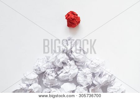 Social Pyramid Concept. Flat Lay Of Crumpled Same Color Paper Balls Under Dominant Individual Red On