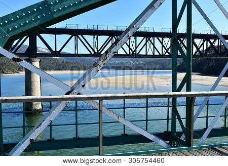 Beach With Old And New Train Bridges. O Barqueiro, Spain.
