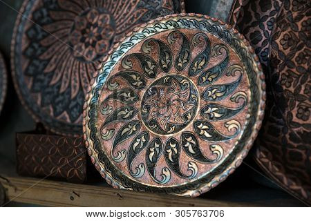 Copper Plate Handcrafted, Traditionally Made In Lagich, Azerbaijan. Handmade Plate In Souvenir Shop.