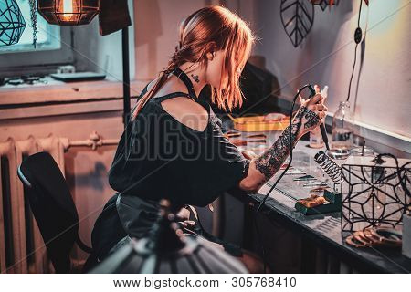Talanted Young Woman Is Working On Her Own Project At Glass Workshop.