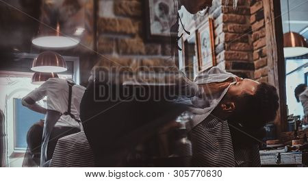 Attractive Relaxed Man Just Got Great Service From Talanted Trendy Barber.