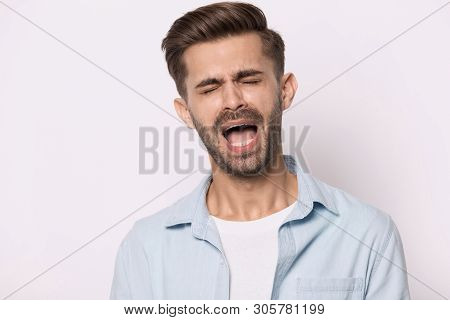 Hysterical Guy Closed Eyes Screaming Or Whines Isolated On White