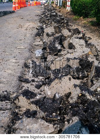The Road Repairing Works With Jackhammer. Machine Drills Asphalt