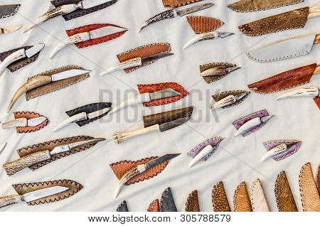Flat Lay Photo Of Knives With Bone Handles Against White Background