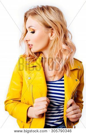 Young Blonde Girl With An Original Hairstyle And Bright Professional Makeup