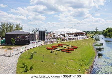 City Jelgava, Latvian Republic. River Lielupe, Sand Sculpture Event And Concert. Flower Garden And P