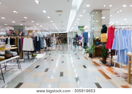 Blurred Showcases Fashion Boutique Clothing Store In A Modern Shopping Mall. Cloth And Acessorie Mod