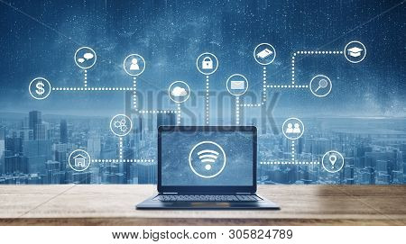 Computer Laptop On Wooden Desk With Wireless And Application Programming And Social Media Icons. Int