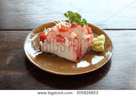 Octopus Sashimi On A Plate In Closeup